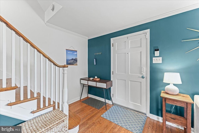 809 Addingham Ave, Drexel Hill, PA 19026 - foyer entrance featuring wood finished floors, stairway, and ornamental molding