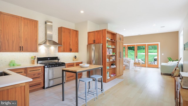 18 Hart Ave, Hopewell, NJ 08525 - kitchen with stainless steel appliances, wall chimney exhaust hood, open shelves, decorative backsplash, and light countertops