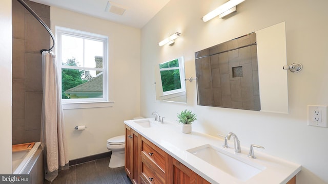 18 Hart Ave, Hopewell, NJ 08525 - bathroom featuring double vanity, healthy amount of natural light, and wood finished floors