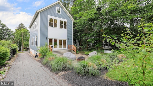 18 Hart Ave, Hopewell, NJ 08525 - view of front of property with a fire pit and french doors