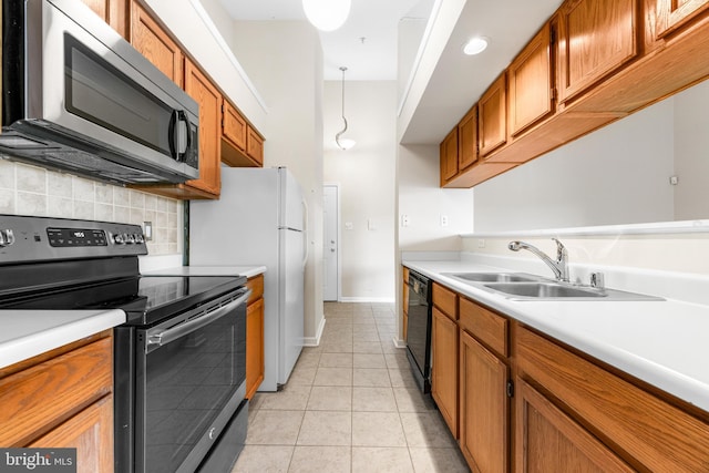 7854 Cornerstone Way Unit 8-7854, Windsor Mill, MD 21244 - kitchen with stainless steel appliances, brown cabinets, backsplash, and light countertops