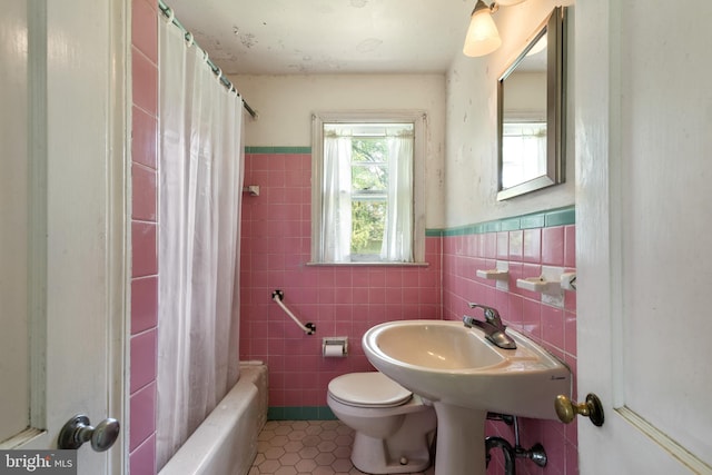 214 Sugartown Rd, Devon, PA 19333 - bathroom with tile walls, tile patterned flooring, wainscoting, and shower / tub combo with curtain