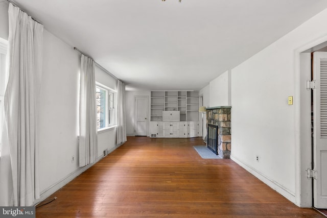 214 Sugartown Rd, Devon, PA 19333 - unfurnished living room featuring a fireplace and wood finished floors