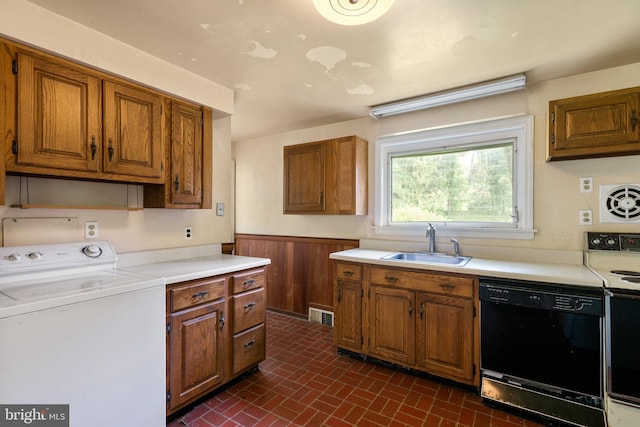 214 Sugartown Rd, Devon, PA 19333 - kitchen with washer / dryer, black dishwasher, a wainscoted wall, range with electric stovetop, and brown cabinetry