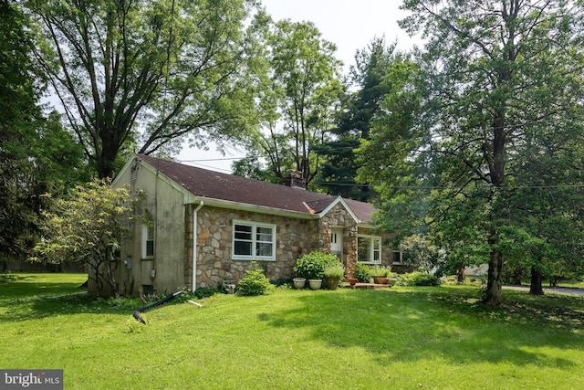214 Sugartown Rd, Devon, PA 19333 - view of front of house featuring stone siding and a front yard