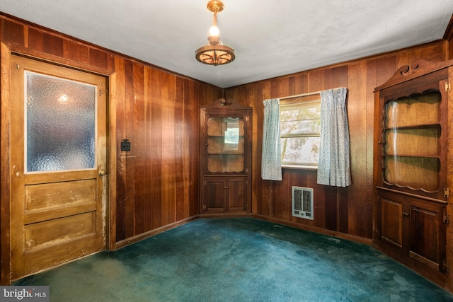 214 Sugartown Rd, Devon, PA 19333 - spare room featuring heating unit, wooden walls, and carpet flooring