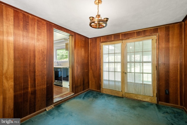 214 Sugartown Rd, Devon, PA 19333 - unfurnished room with wooden walls, carpet floors, a chandelier, and french doors