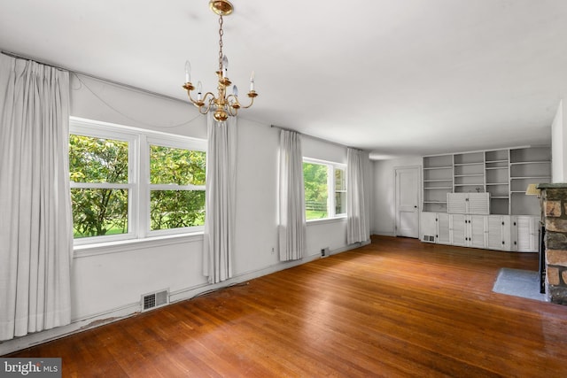 214 Sugartown Rd, Devon, PA 19333 - unfurnished living room with a chandelier and hardwood / wood-style floors