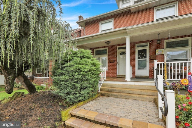 210 N Waverly St, Reading, PA 19607 - entrance to property featuring brick siding and covered porch