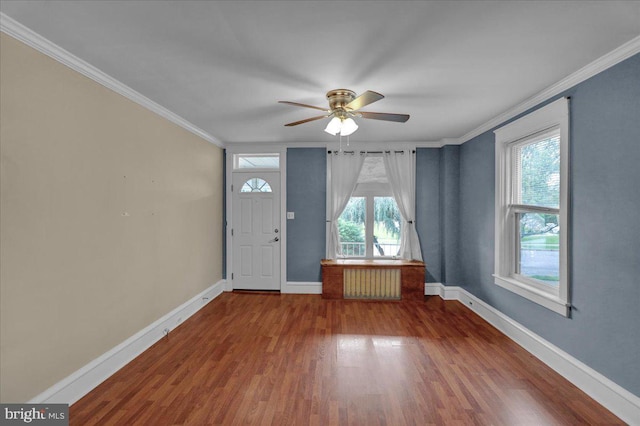 210 N Waverly St, Reading, PA 19607 - entrance foyer featuring ornamental molding, ceiling fan, wood finished floors, and radiator