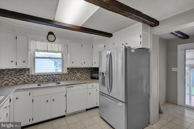 210 N Waverly St, Reading, PA 19607 - kitchen with dishwasher, stainless steel fridge with ice dispenser, light tile patterned floors, tasteful backsplash, and beam ceiling