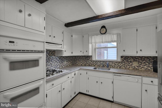 210 N Waverly St, Reading, PA 19607 - kitchen featuring white appliances, backsplash, white cabinetry, light tile patterned flooring, and under cabinet range hood