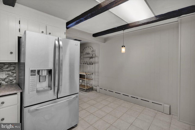 210 N Waverly St, Reading, PA 19607 - kitchen with stainless steel fridge, baseboard heating, white cabinets, tasteful backsplash, and beam ceiling