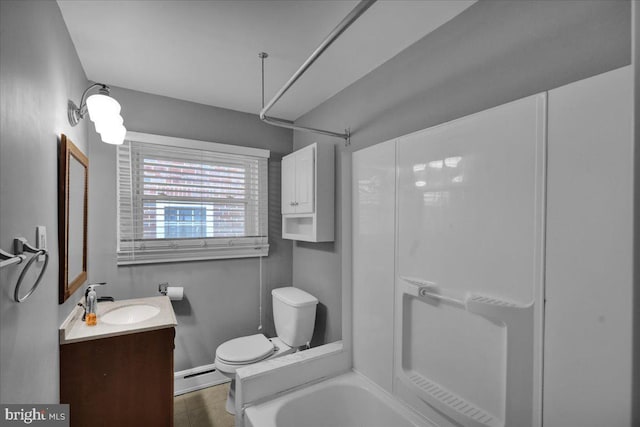 210 N Waverly St, Reading, PA 19607 - bathroom featuring a baseboard heating unit, vanity, and shower / tub combination