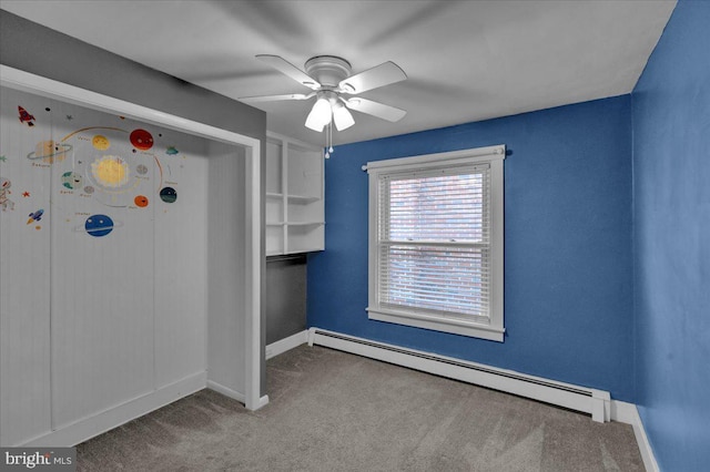 210 N Waverly St, Reading, PA 19607 - spare room featuring a baseboard heating unit, carpet flooring, and a ceiling fan