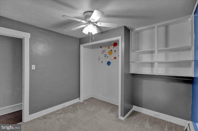 210 N Waverly St, Reading, PA 19607 - unfurnished bedroom with a baseboard heating unit, ceiling fan, and carpet