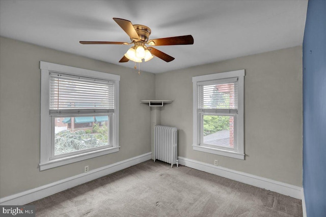 210 N Waverly St, Reading, PA 19607 - empty room featuring radiator, healthy amount of natural light, carpet, and a ceiling fan