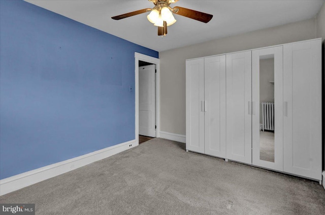 210 N Waverly St, Reading, PA 19607 - unfurnished bedroom with radiator, carpet, a closet, and ceiling fan