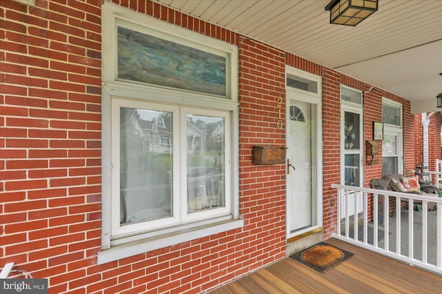 210 N Waverly St, Reading, PA 19607 - view of exterior entry featuring brick siding and covered porch