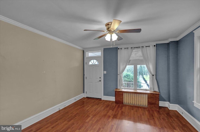 210 N Waverly St, Reading, PA 19607 - foyer with radiator heating unit, ceiling fan, wood finished floors, and ornamental molding