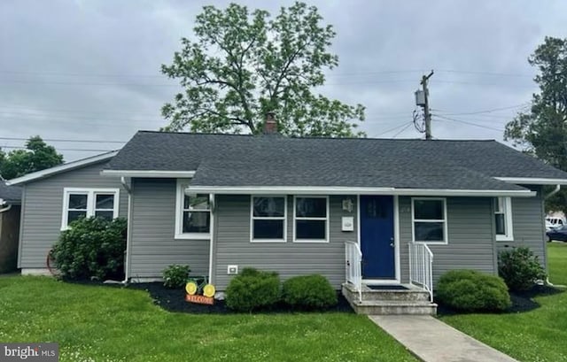 253 St, Carneys Point, NJ 08069 - view of front facade featuring a front lawn and a chimney