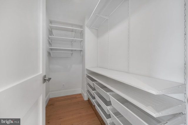 2829 Connecticut Ave NW Unit 706, Washington, DC 20008 - walk in closet featuring wood finished floors