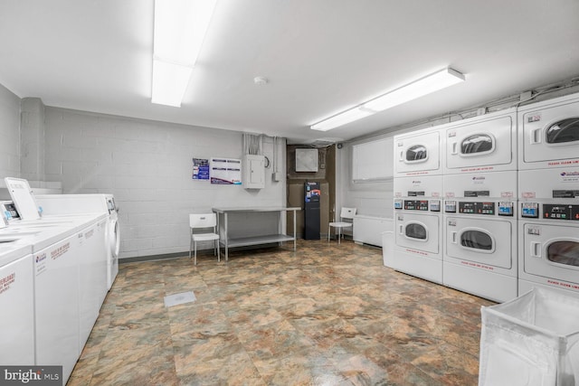 2829 Connecticut Ave NW Unit 706, Washington, DC 20008 - community laundry room with estacked washer and dryer, separate washer and dryer, and concrete block wall