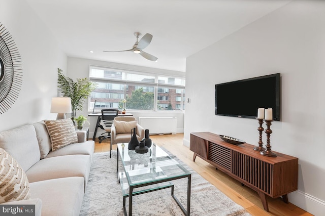 2829 Connecticut Ave NW Unit 706, Washington, DC 20008 - living area featuring a ceiling fan, wood finished floors, an office area, and radiator