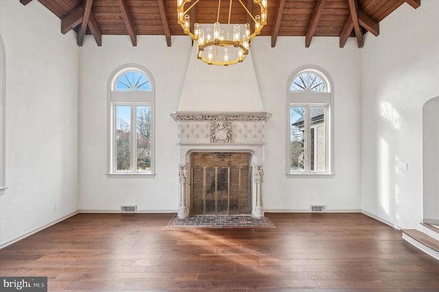 4127 Presidential Dr, Lafayette Hill, PA 19444 - unfurnished living room featuring a wood ceiling with exposed beams, arched walkways, hardwood / wood-style flooring, high vaulted ceiling, and a fireplace