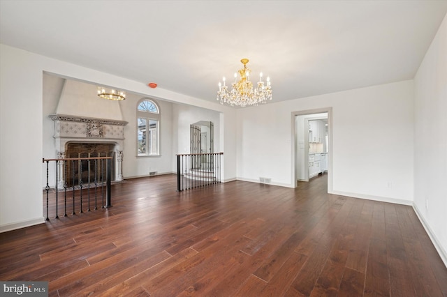 4127 Presidential Dr, Lafayette Hill, PA 19444 - unfurnished living room featuring a chandelier, wood finished floors, and a fireplace with flush hearth