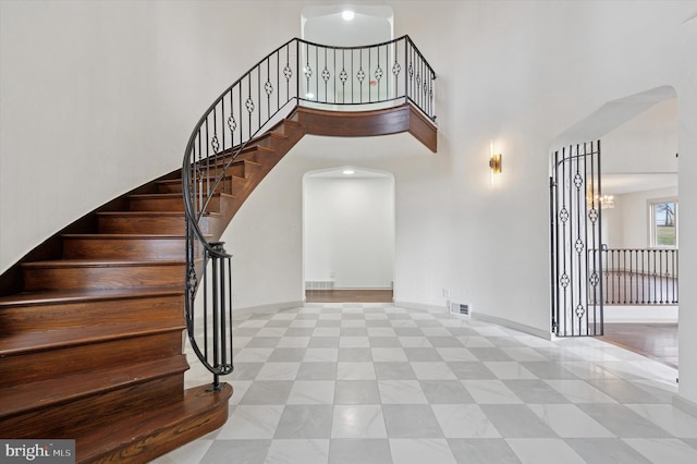 4127 Presidential Dr, Lafayette Hill, PA 19444 - staircase with arched walkways and a towering ceiling