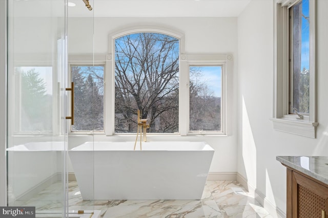 4127 Presidential Dr, Lafayette Hill, PA 19444 - bathroom featuring marble finish floors, a freestanding tub, and vanity
