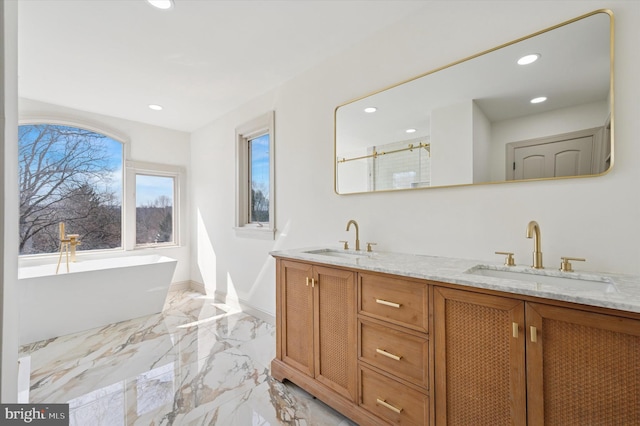 4127 Presidential Dr, Lafayette Hill, PA 19444 - bathroom with marble tiled floors, double vanity, a freestanding tub, recessed lighting, and an enclosed shower