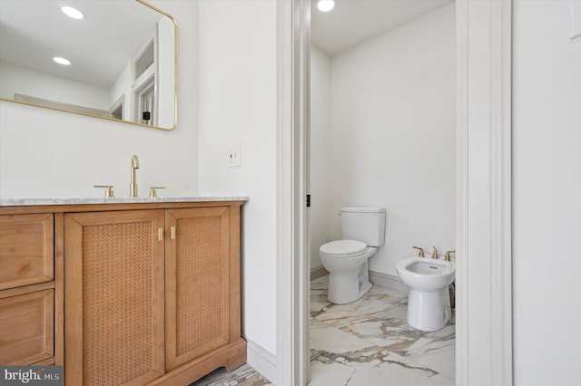 4127 Presidential Dr, Lafayette Hill, PA 19444 - bathroom with marble finish floors, a bidet, vanity, and recessed lighting