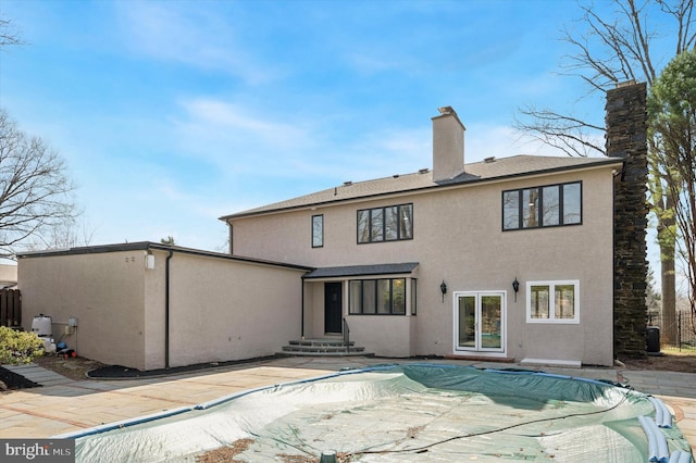4127 Presidential Dr, Lafayette Hill, PA 19444 - rear view of property with entry steps, stucco siding, a patio, a covered pool, and a chimney