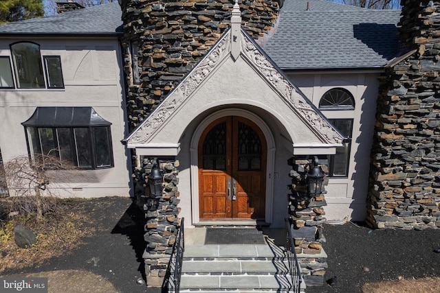 4127 Presidential Dr, Lafayette Hill, PA 19444 - property entrance featuring stucco siding, a shingled roof, and a chimney