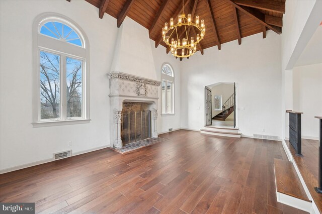 4127 Presidential Dr, Lafayette Hill, PA 19444 - unfurnished living room featuring a wooden ceiling with exposed beams, high vaulted ceiling, a chandelier, healthy amount of natural light, and a fireplace
