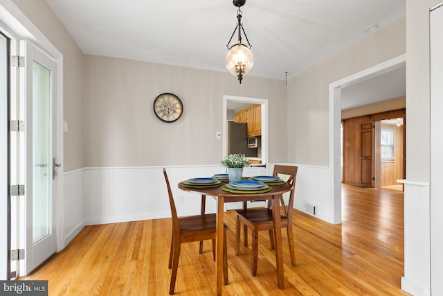 207 Commonwealth Ave, Claymont, DE 19703 - dining space with wainscoting and light wood finished floors