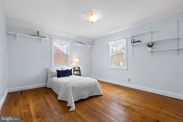 207 Commonwealth Ave, Claymont, DE 19703 - bedroom with multiple windows and wood finished floors