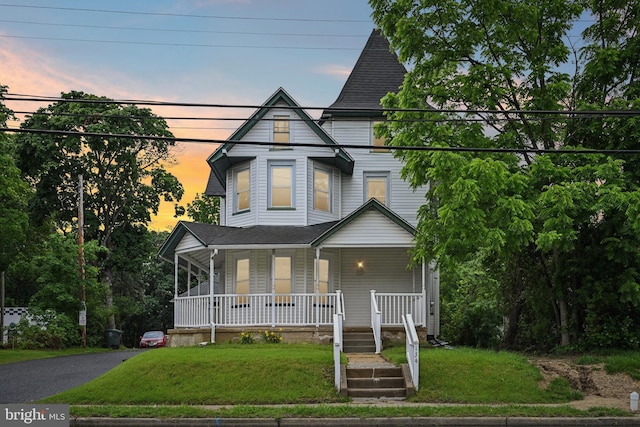 134 S Main St, Glassboro, NJ 08028 - victorian home with a porch, a yard, and roof with shingles