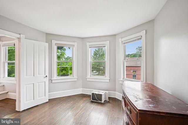 134 S Main St, Glassboro, NJ 08028 - sitting room featuring dark wood-style floors, healthy amount of natural light, and an AC wall unit