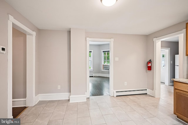 134 S Main St, Glassboro, NJ 08028 - spare room with baseboard heating, light tile patterned floors, and cooling unit