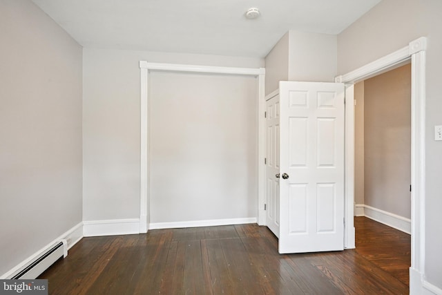 134 S Main St, Glassboro, NJ 08028 - unfurnished bedroom featuring a baseboard radiator, hardwood / wood-style flooring, and a closet