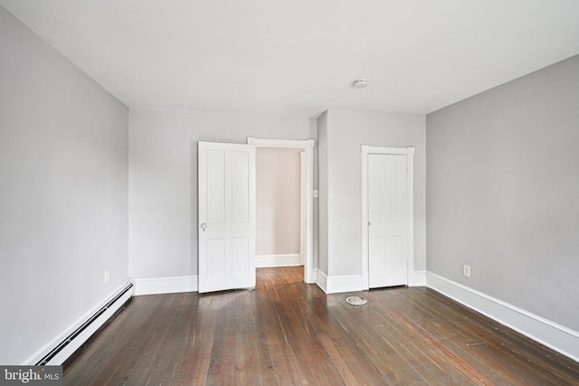 134 S Main St, Glassboro, NJ 08028 - unfurnished bedroom featuring a baseboard heating unit, hardwood / wood-style flooring, and a closet
