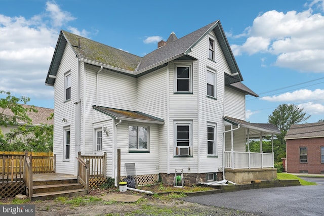 134 S Main St, Glassboro, NJ 08028 - view of property exterior featuring covered porch, a shingled roof, and a deck