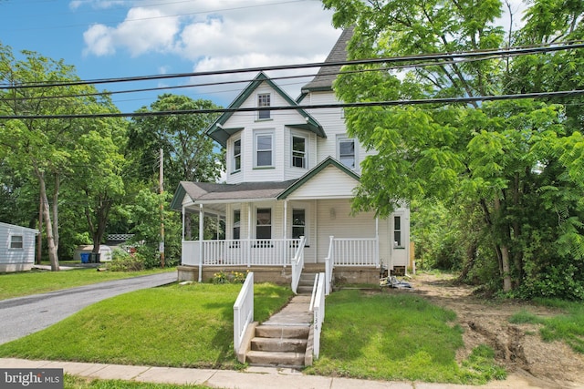 134 S Main St, Glassboro, NJ 08028 - victorian home with a porch and a front lawn