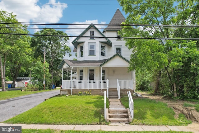 134 S Main St, Glassboro, NJ 08028 - victorian home featuring covered porch and a front lawn
