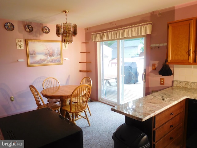 7799 Outing Ave, Pasadena, MD 21122 - dining space featuring a chandelier and light colored carpet