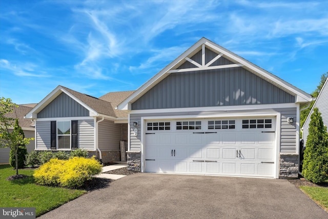 92 Senators Way, Berlin, NJ 08009 - view of front of house with board and batten siding, stone siding, asphalt driveway, and an attached garage