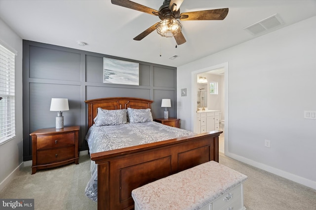 92 Senators Way, Berlin, NJ 08009 - bedroom featuring light carpet, a decorative wall, ensuite bathroom, and ceiling fan